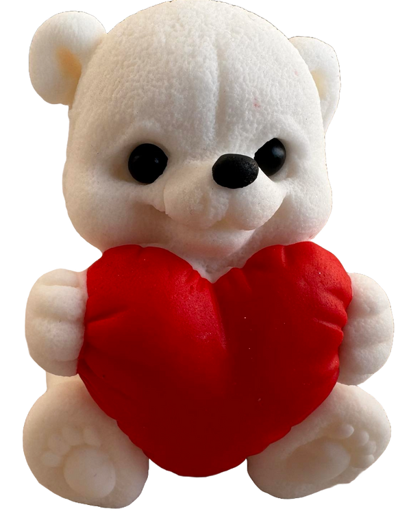 Edible decoration of sugar paste, white teddy bear with a red heart